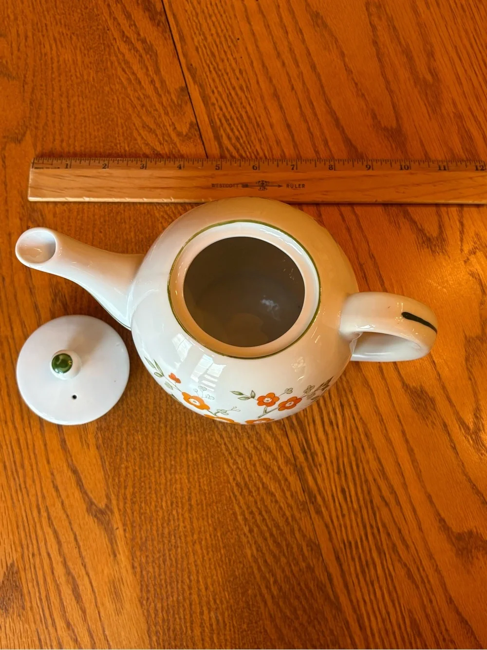 White Ceramic Teapot with Orange Floral Pattern